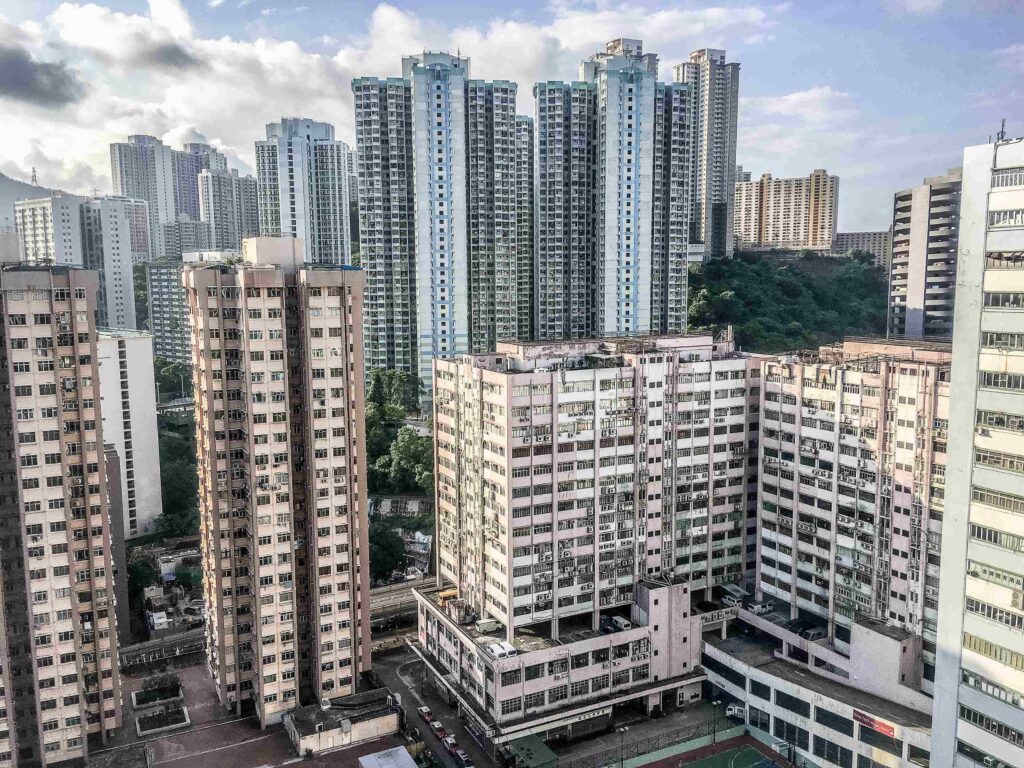 wide angle shot several buildings hong kong built each other daytime 11zon